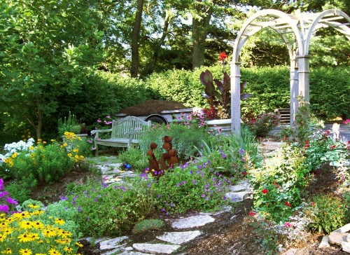 Back garden with arch and bench